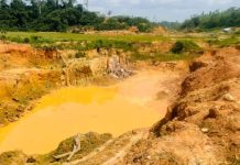 Ghana Galamsey Satire: Eating Death with a Smile Ghana galamsey satire — polluted mining pit with toxic yellow water showing environmental destruction