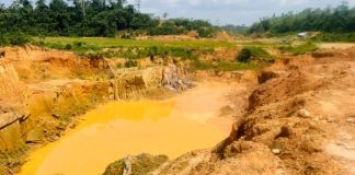Ghana Galamsey Satire: Eating Death with a Smile Ghana galamsey satire — polluted mining pit with toxic yellow water showing environmental destruction