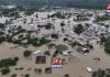 AN OPEN LETTER TO THE PRESIDENT: THE EXCAVATORS ARE BACK Galamsey and severe flooding in Samreboi, Ghana, showing homes and buildings submerged in muddy floodwaters.