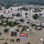 AN OPEN LETTER TO THE PRESIDENT: THE EXCAVATORS ARE BACK Galamsey and severe flooding in Samreboi, Ghana, showing homes and buildings submerged in muddy floodwaters.