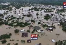 AN OPEN LETTER TO THE PRESIDENT: THE EXCAVATORS ARE BACK Galamsey and severe flooding in Samreboi, Ghana, showing homes and buildings submerged in muddy floodwaters.