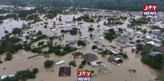 AN OPEN LETTER TO THE PRESIDENT: THE EXCAVATORS ARE BACK Galamsey and severe flooding in Samreboi, Ghana, showing homes and buildings submerged in muddy floodwaters.
