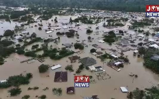 AN OPEN LETTER TO THE PRESIDENT: THE EXCAVATORS ARE BACK Galamsey and severe flooding in Samreboi, showing homes and buildings submerged in muddy floodwaters.