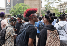 Breaking: Universities Discover the Real Cause of Poor Grades University Hairstyles Debate showing students with colourful hairstyles and earrings on a Ghanaian university campus.
