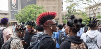 Breaking: Universities Discover the Real Cause of Poor Grades University Hairstyles Debate showing students with colourful hairstyles and earrings on a Ghanaian university campus.